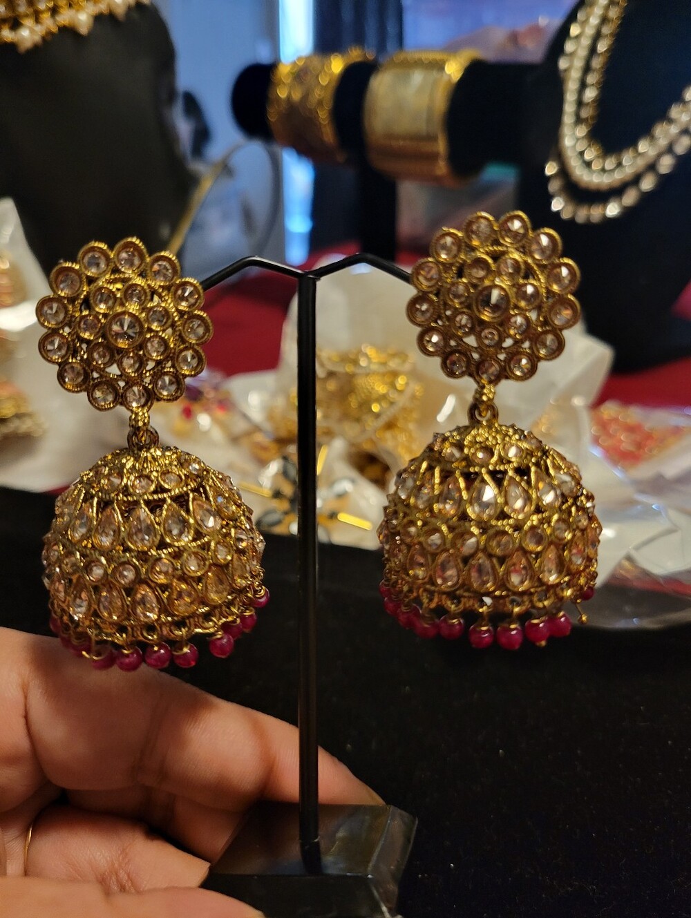 Gold Kundan Jhumka Earrings with Pink Bead Accents